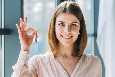 Lovely Woman Holding Keys Free Photo