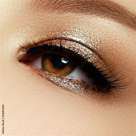 Close Up Of Blue Woman Eye With Beautiful Brown With Shades Smokey Eyes Makeup Modern Fashion