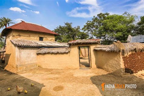 Mud Hut With Poultry In The Courtyard At An Indian Village In West