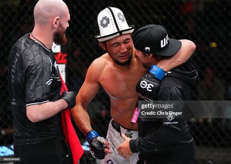 Myktybek Orolbai of Kyrgyzstan celebrates with coach Urijah Faber ...