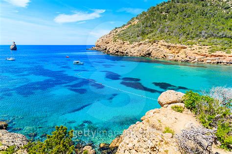 View Of Cala Benirras Beach With Azure Blue Sea Water Ibiza Island