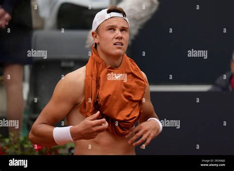 Denmark's Holger Rune changes his shirt during a semi final match ...