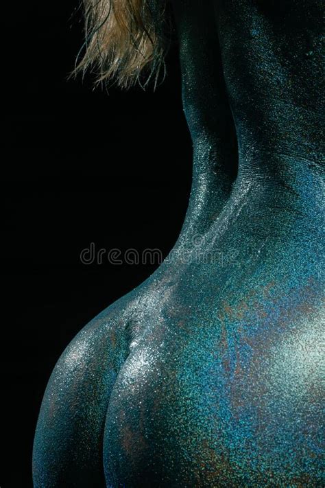 Gorgeous Naked Brunette Posing Painted In Turquoise Sequins Stock