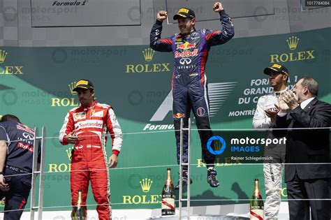 Sebastian Vettel 1st Position Celebrates On The Podium Alongside Fernando Alonso 2nd Position