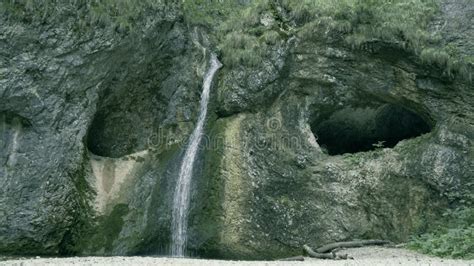 Waterfall and Cave Entrances in a Mountain Area Stock Image - Image of highlands, admiring ...