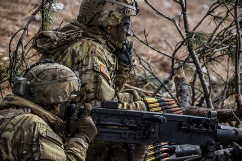 An assistant gunner feeds .50 cal. rounds as the gunner - NARA & DVIDS ...