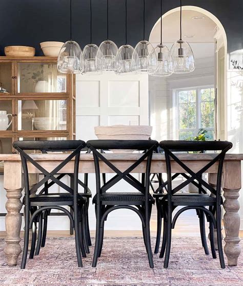 Black Wood Dining Chairs On A Reddish Area Rug Soul Lane