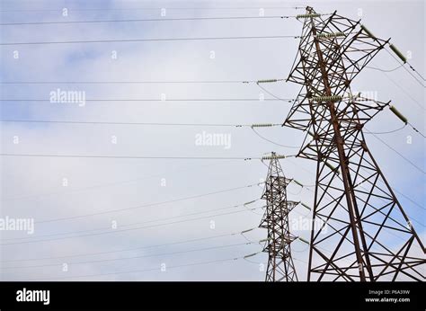 The Silhouette Of The Electricity Transmission Pylon In Daytime