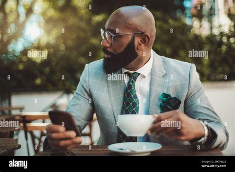 A Portrait Of A Handsome Dapper Bald Mature Black Man Entrepreneur With