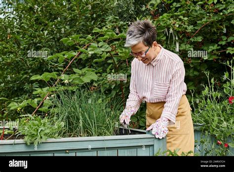 Appealing Joyful Mature Woman In Casual Attire With Glasses Working In
