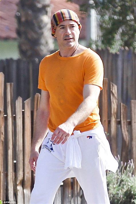 Robert Downey Jr Stands Out In Colorful Beanie And Orange T Shirt