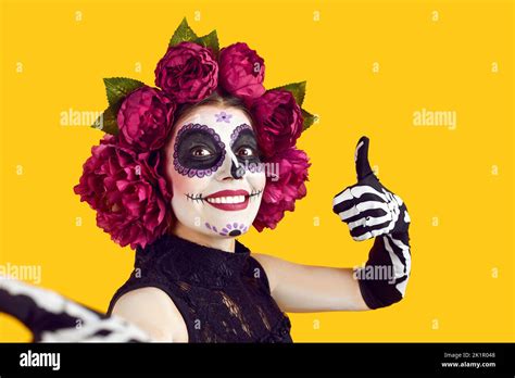 Crazy Woman In Halloween Costume With Wreath Of Pink Flowers And Scary
