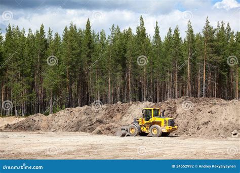 Excavator At Sandpit During Earthmoving Works Royalty Free Stock Image