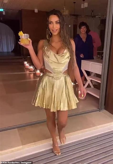 Kim Kardashian Dons Metallic Gold Dress As Shares Videos From Lavish