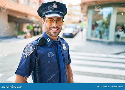 Young Handsome Hispanic Policeman Wearing Police Uniform Smiling Happy