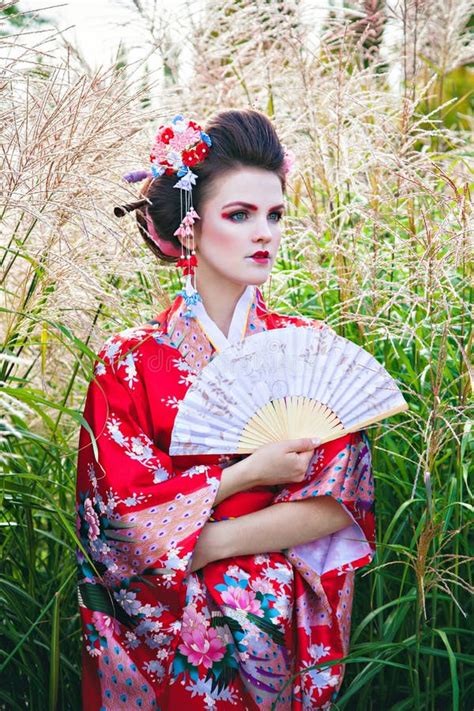 Young Woman In Geisha Costume With Fancy Makeup Stock Photo Image Of