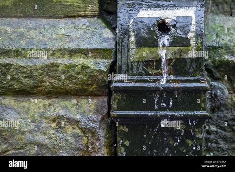 Damaged Square Section Cast Iron Drain Pipe Leaking Water Stock Photo