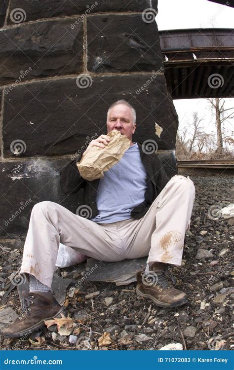 Homeless Man Drinking Alcohol From A Bottle Stock Photo Cartoondealer