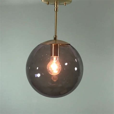 Stylish Smoked Glass Globe Pendant Add Elegance To Any Space Smokedbyewe