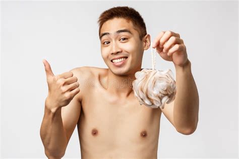 Beauty People And Hygiene Concept Portrait Of Satisfied Cute Asian Man With Naked Torso