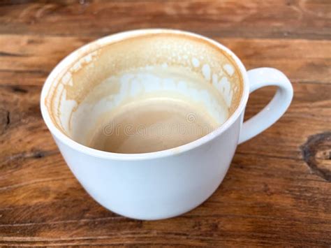 Nearly Empty Coffee Mug On A Wooden Background Stock Photo Image Of