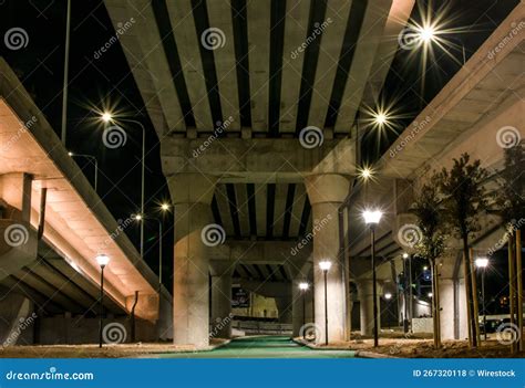 Giant Bridge Over a Road with Lights at Night Stock Photo - Image of ...