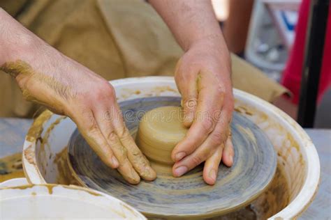 Potter In The Process Of Working On A Potters Wheel Close Up Hands