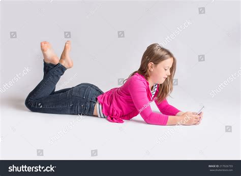 Young Girl Lying On Stomach Whilearkivfotografi217926733 Shutterstock