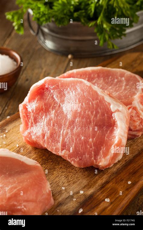 Raw Organic Boneless Pork Chops Ready To Cook Stock Photo Alamy