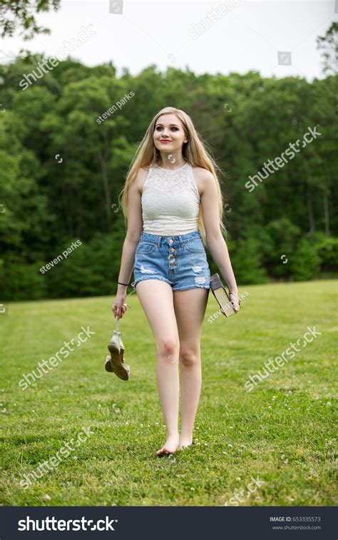 Blonde Female Teenager Wearing Shorts Park Stock Photo Shutterstock