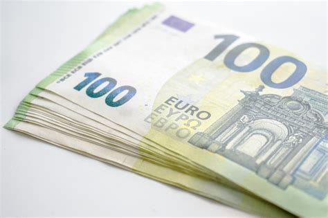 Premium Photo | 100 Euro banknotes on the table