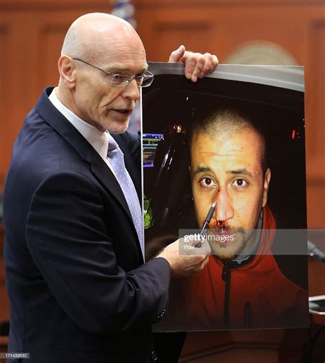 Don West A Defense Attorney For George Zimmerman Displays A Photo