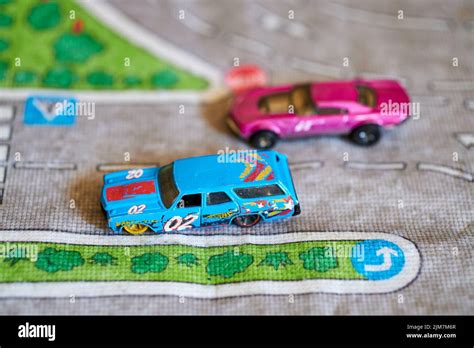 A Selective Focus Of A Mix Of Mattel Hot Wheels Toy Model Blue Car With The Number On It On A