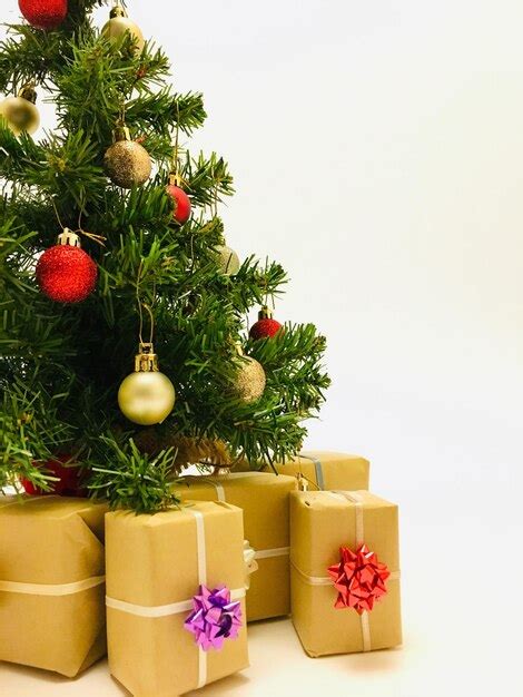 Premium Photo Christmas Tree With Gift Boxes Against White Background