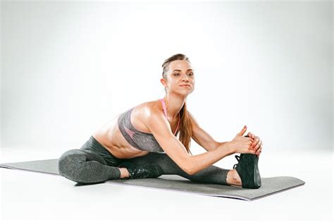 Free Photo Beautiful Slim Brunette Doing Some Stretching Exercises In A Gym