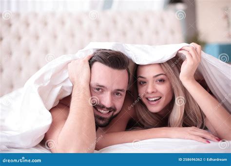 Business People Shaking Hands Sitting At The Office Desk Stock Photo