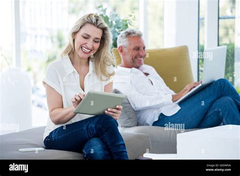 Smiling Mature Couple Using Technology Stock Photo Alamy