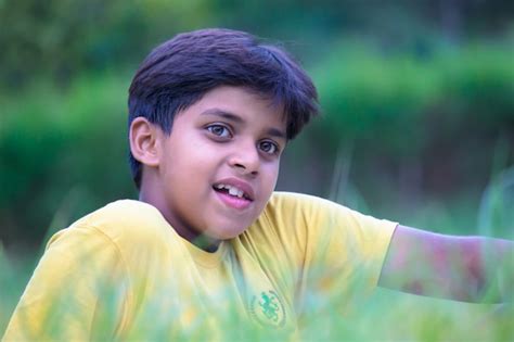 Premium Photo Portrait Of Handsome Smart Indian Kid Outdoors And