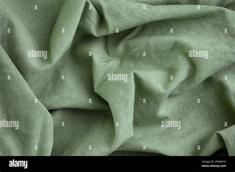 Green Crumpled Fabric Texture Background Close Up Stock Photo Alamy