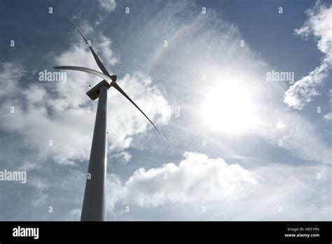 Wind Turbine Against Blue Sky Stock Photo Alamy