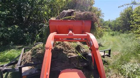 Pulling Trailer And Loading Grass Clippings With Kubota Bx Youtube