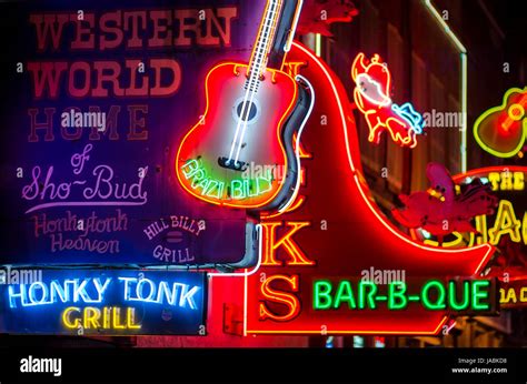 NASHVILLE - JULY 10, 2014: Bright neon signs of the city's honky tonk ...