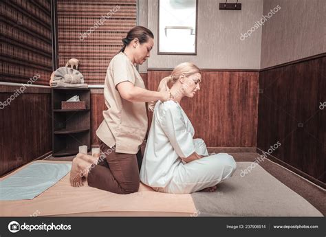 Pleasure Beautiful Blonde Woman Sitting Front Masseuse While Enjoying Shoulder Stock Photo By
