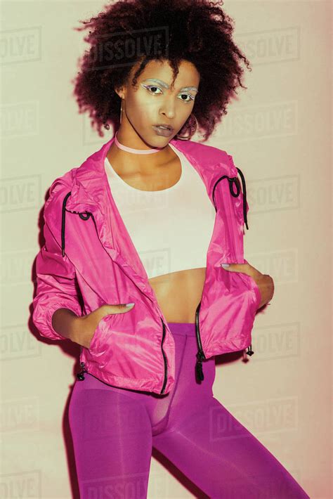 African American 80s Girl In Pink Clothes Posing For Fashion Shoot