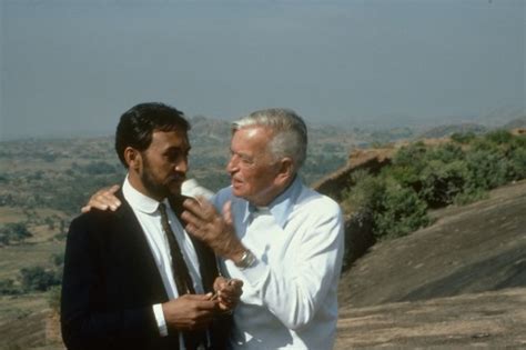 David Lean giving direction to Victor Banerjee on location for "A ...