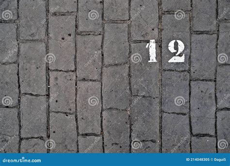 Number 12, Twelve, White Stencil Number Painted on Cobble Stones. Stock ...