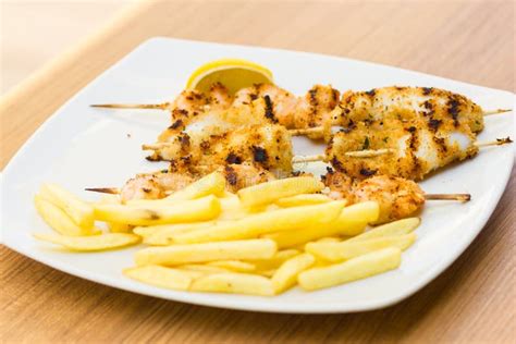 Skewers of grilled squid stock image. Image of roast - 41363009