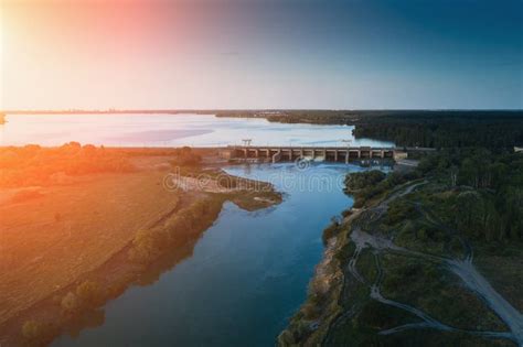 Aerial View of Dam at Reservoir with Flowing Water at Sunset ...