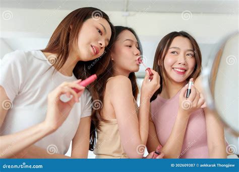 Asian Women Applying Pink Lipstick On Lips Stock Image Image Of