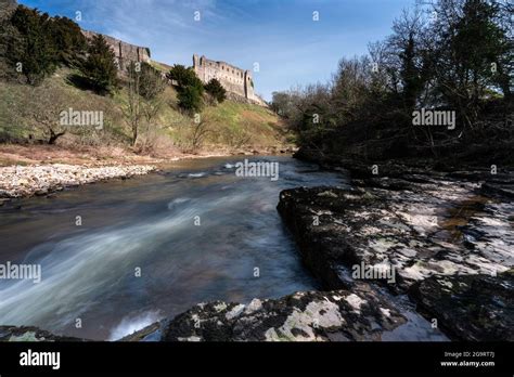 Richmond Castle Ruins Above The Fast Flowing Rapids Of The River Swale